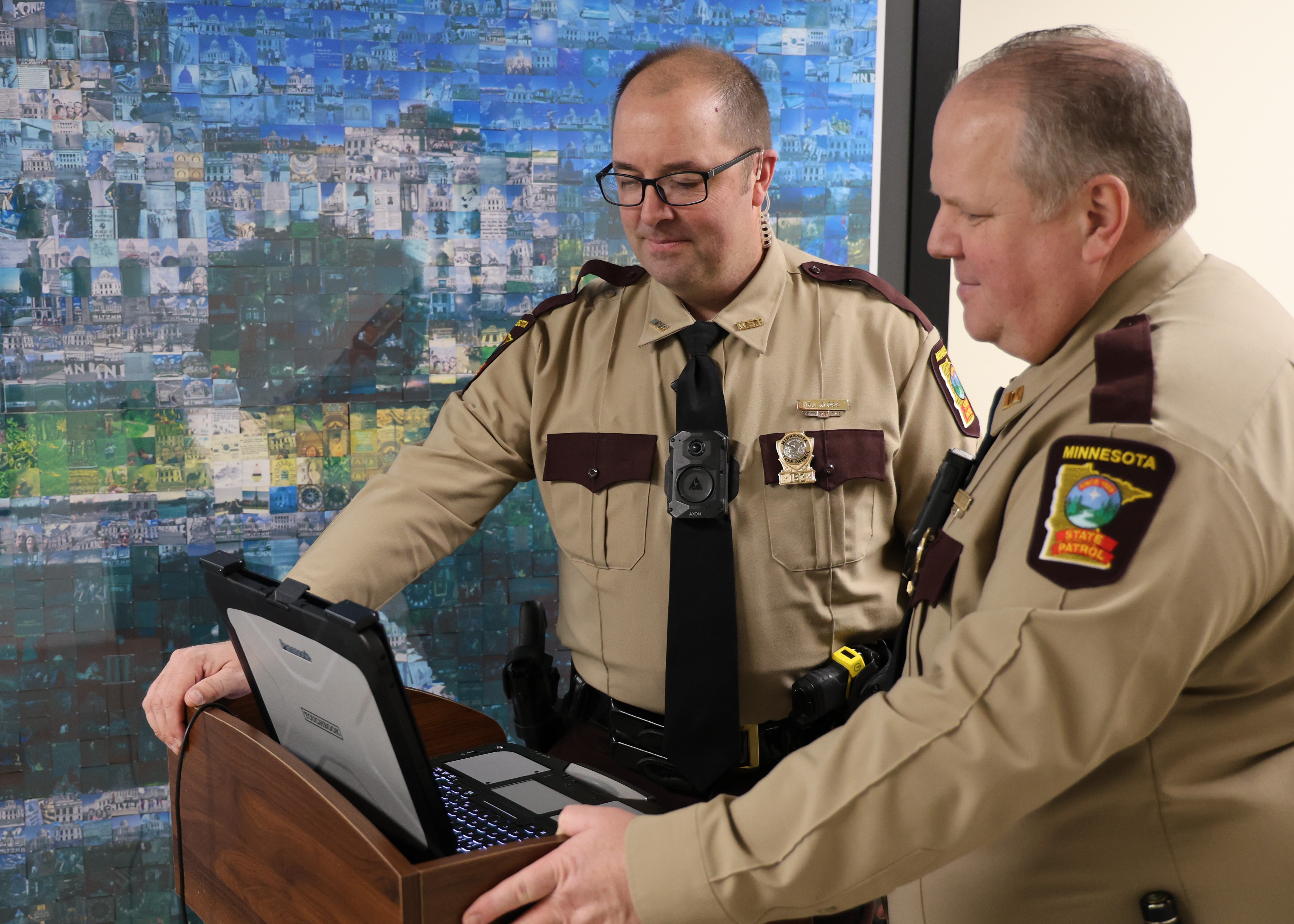 Captain Adam Flynn talks with Trooper Kevin Kloss at a Capitol security screening area.