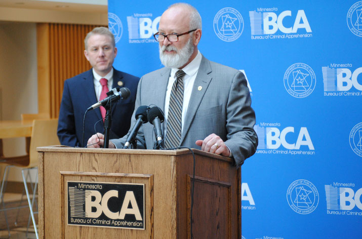 Department of Public Safety Commissioner Bob Jacobson speaks at a news conference as BCA Superintendent Drew Evans looks on.