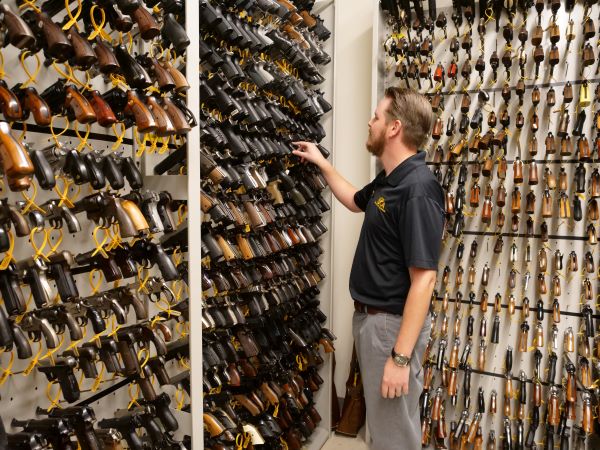 A scientist looking at the firearms reference