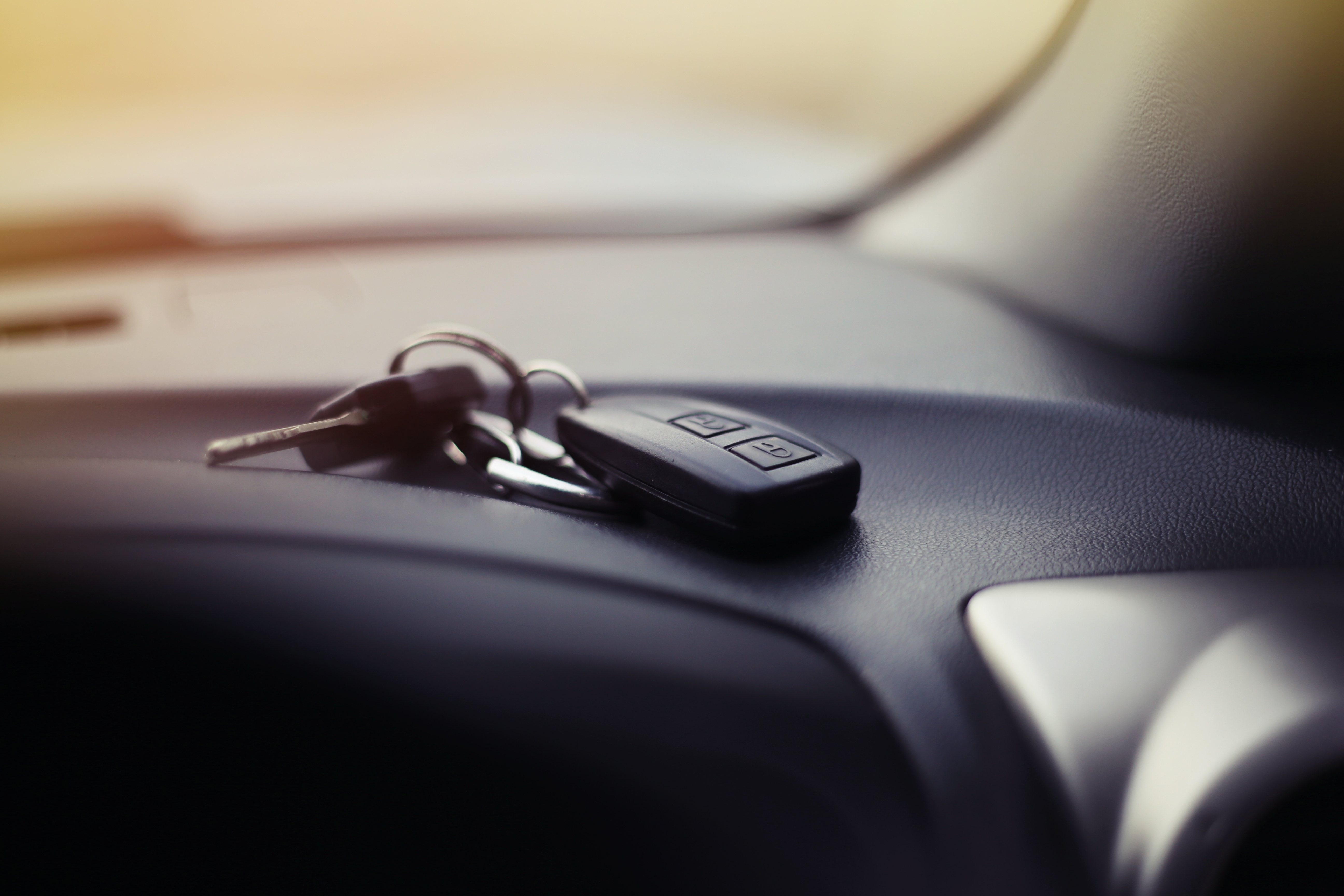 Car keys on the dashboard of a car