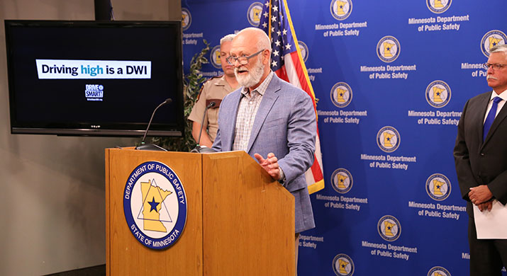 DPS Commissioner Bob Jacobson speaking at a news conference.