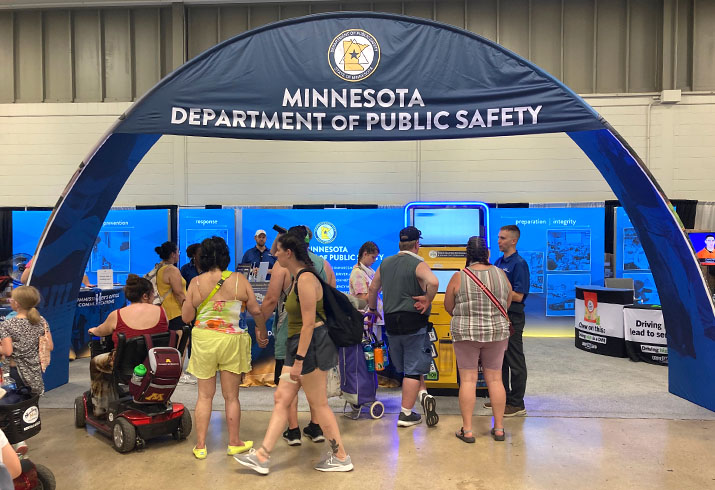 Visitors and staff members at the DPS fair booth.