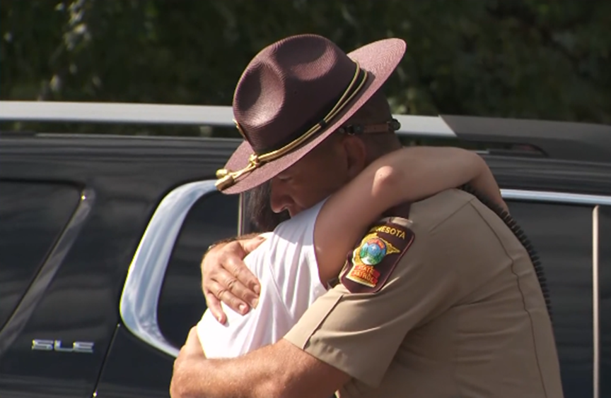 Trooper Eric Ouellette comforting a parent that day