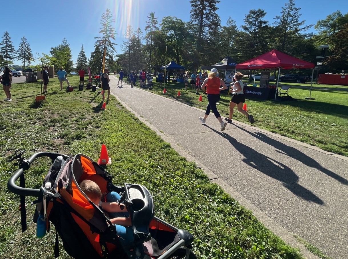 Joggers run down a sidewalk during the 811 run.