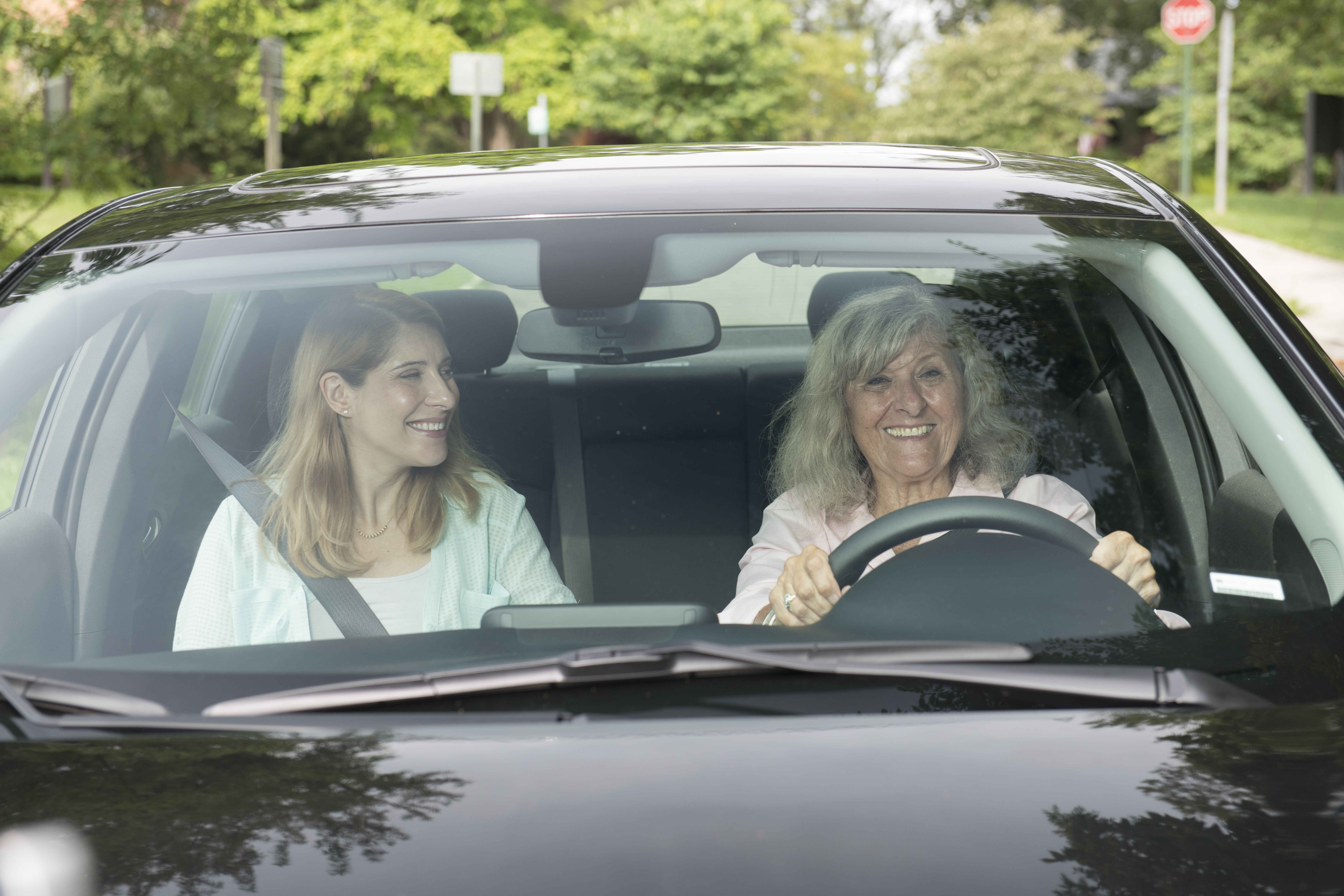 older driver with passenger