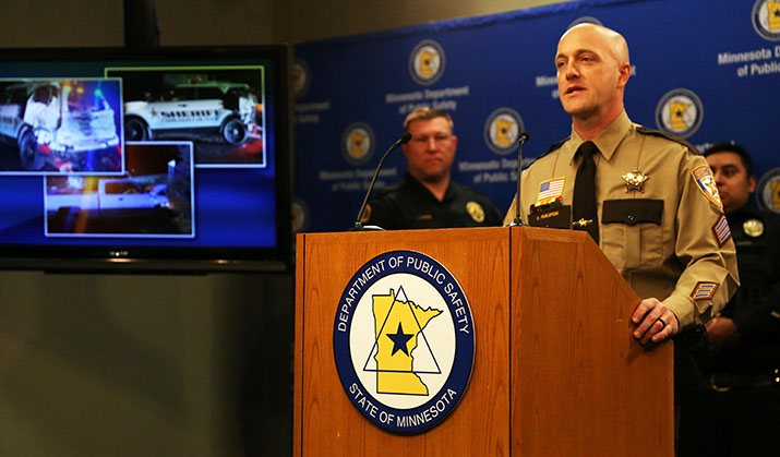 Sgt. Kyle Puelston speaks during a news conference.
