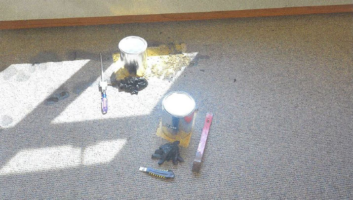 Paint cans and tools on the floor