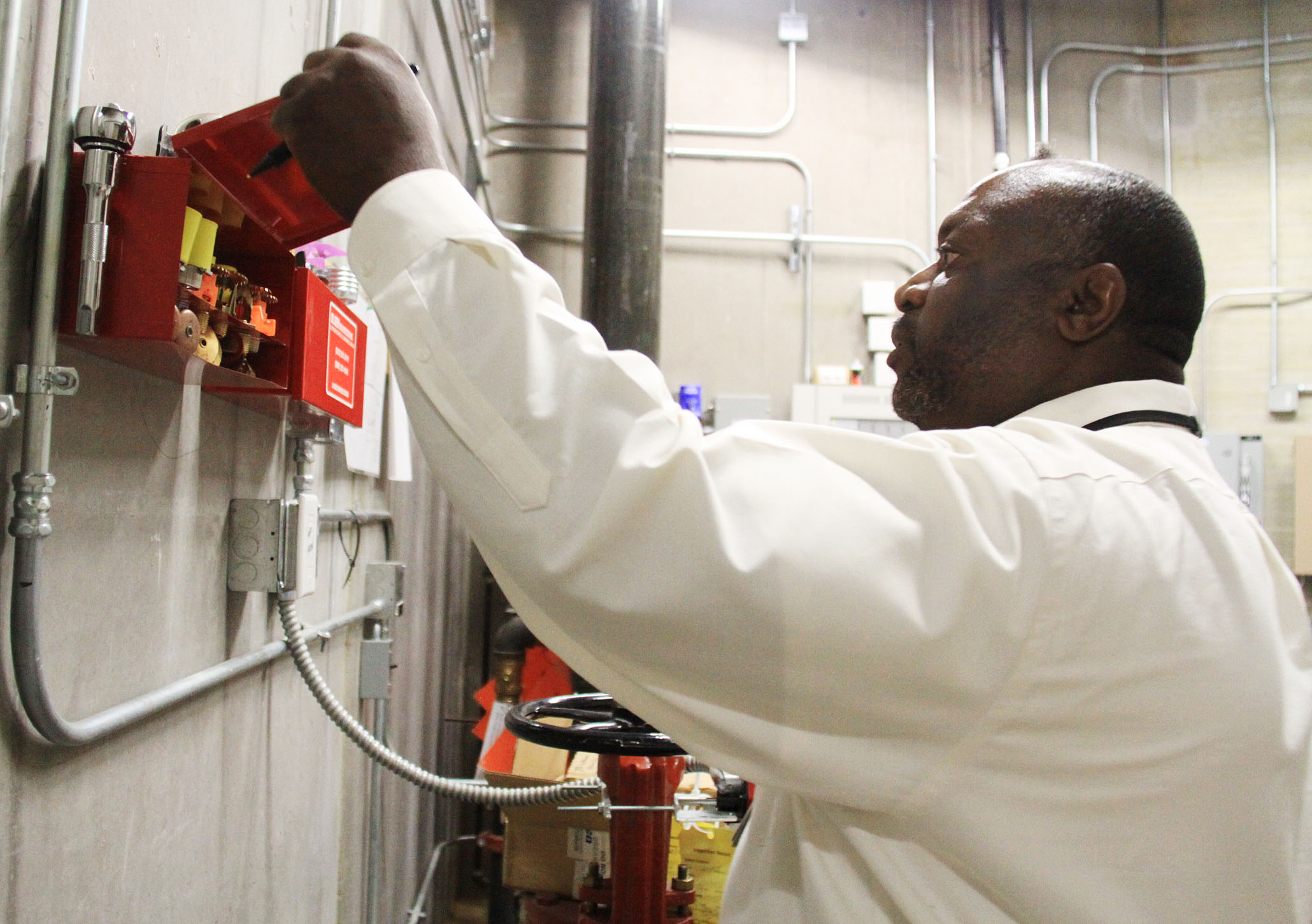 A SFM inspector does an inspection in a correctional facility.