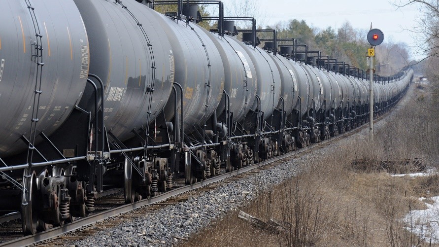 Photo of a train going down a track.